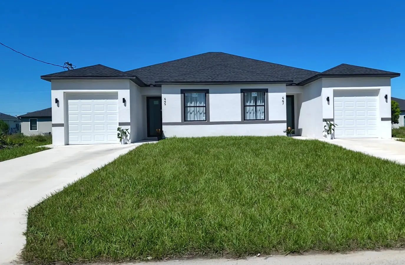 Completed duplex with two single-car garages